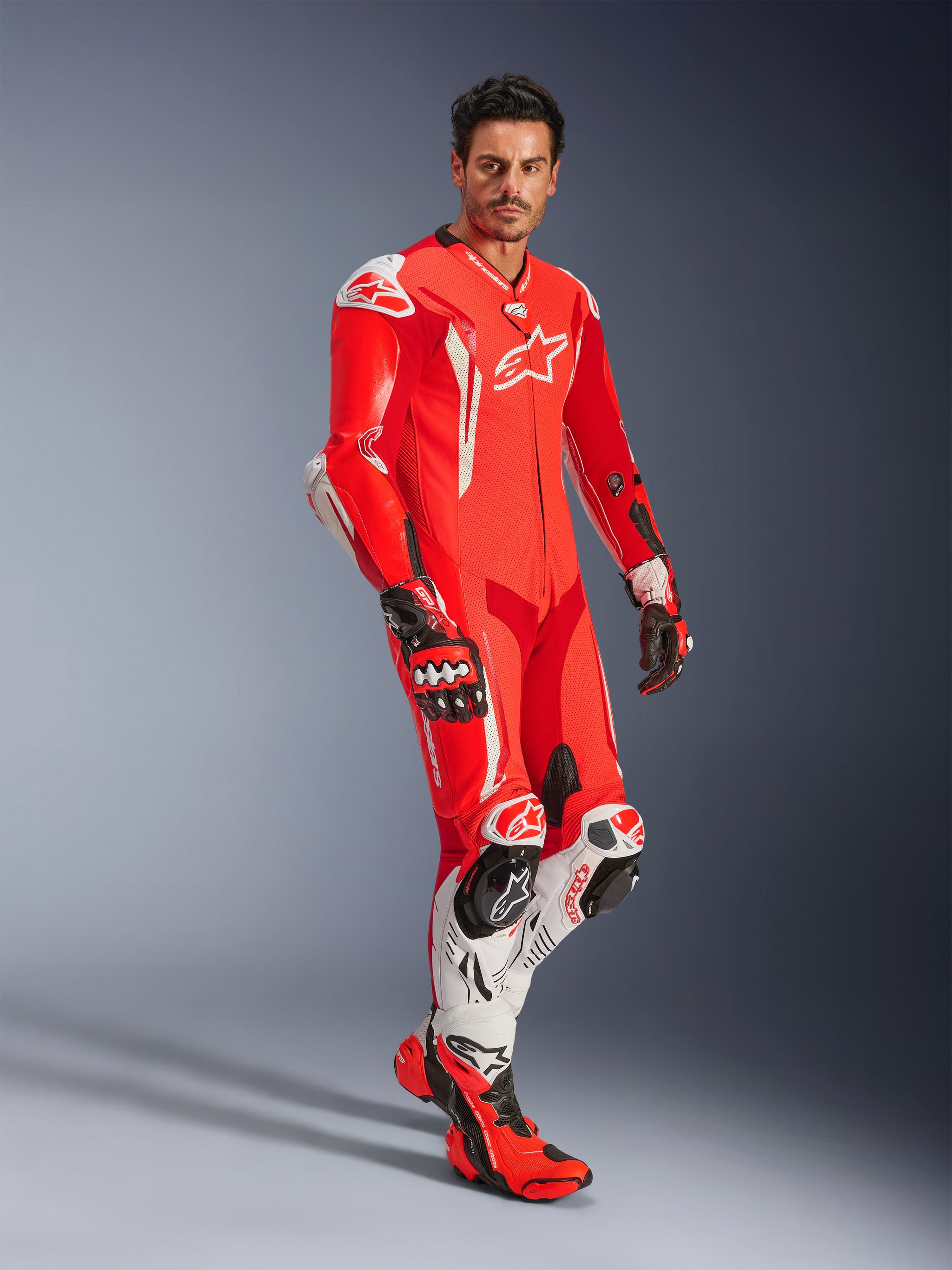 character in suit and motorcycle helmet GP Tech V5 1PC Leather Suit - Motorcycle Suit
