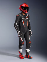 Alpinestars GP Force V2 Leather Suit - 1Piece, professional racing suit in Black White and Red Fluo, featuring perforated leather panels and DFS Lite shields. Complete track setup with red racing helmet, matching gloves, and boots.