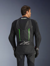 Alpinestars GP Force V2 Leather Suit - 1Piece, Black and Green, back view featuring aerodynamic speed hump, Tech-Air Ready branding, perforated leather zones, and accordion stretch panels for motorcycle racing