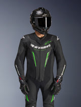 Alpinestars GP Force V2 Leather Suit - 1Piece, Black and Green, motorcycle racing suit worn with a carbon fiber helmet and GP Pro gloves, featuring lime green accents and Alpinestars 'Racing Ahead' branding, engineered for track performance.