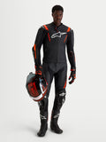 Alpinestars Missile V3 Leather Suit - 2 Piece, Black and Red Fluo men's motorcycle racing suit, featuring AAA-rated leather, aerodynamic race fit, and protective armor while holding a matching helmet