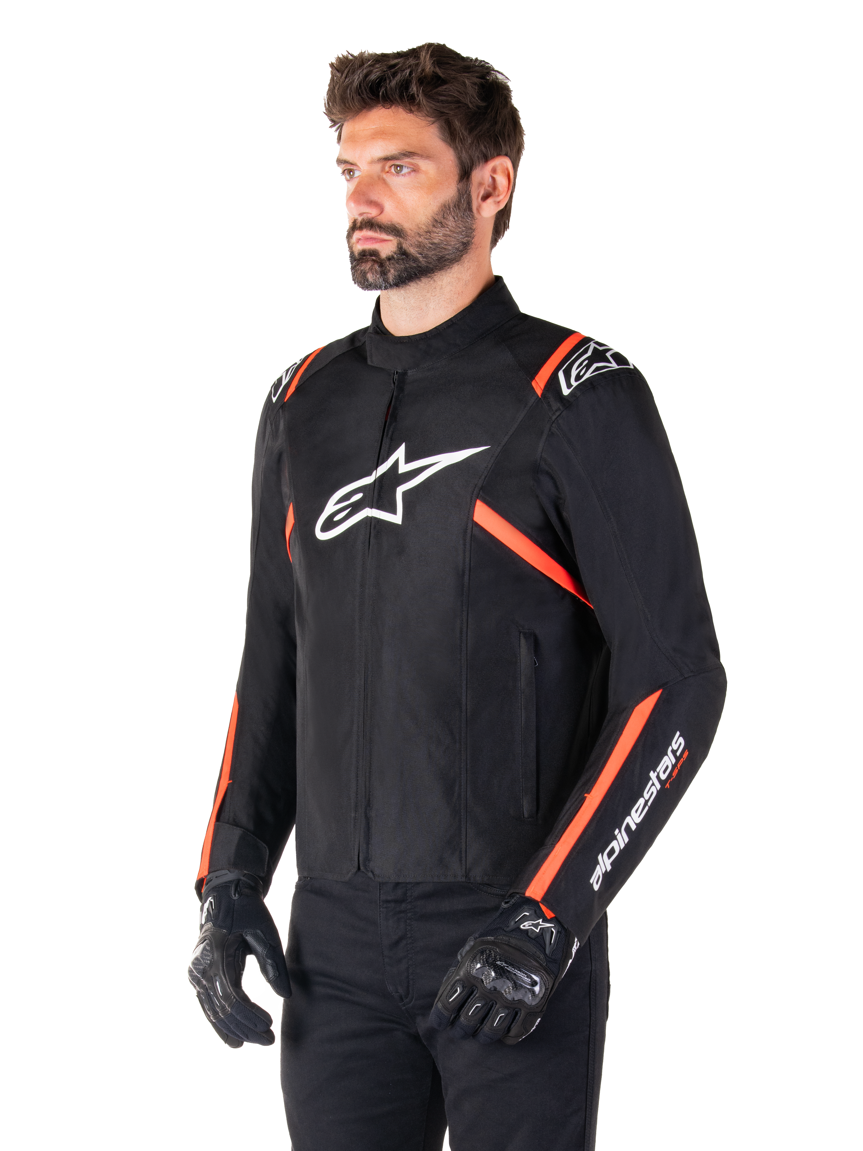 Alpinestars T-SPS V2 Waterproof Jacket, Black White and Red Fluo, worn by a male model with black gloves and pants, featuring a white Alpinestars logo on the chest and fluorescent red accents on the shoulders and sleeves, sporty textile design