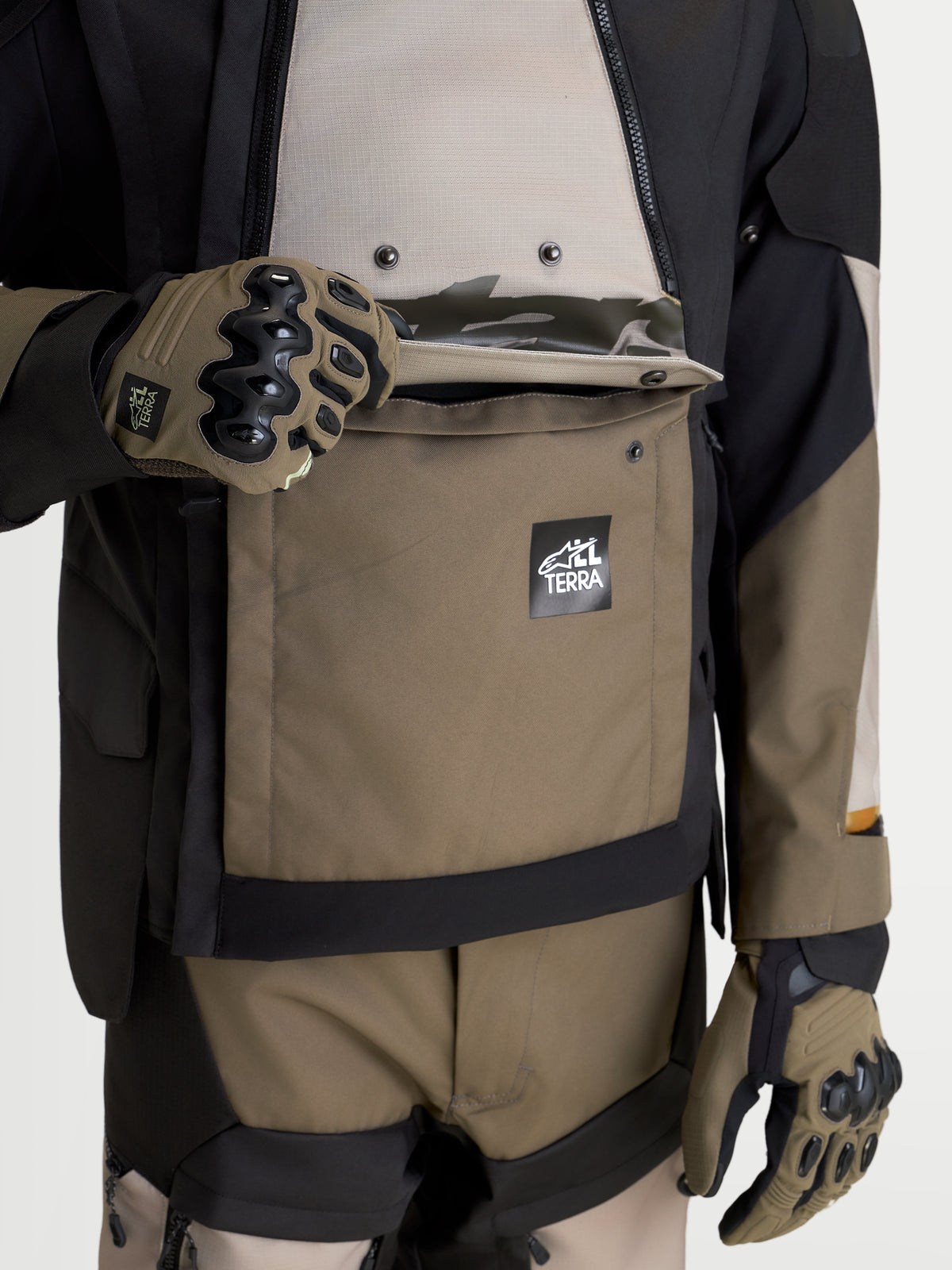 Alpinestars Harok V2 Drystar Jacket, All-Terrain Adventure Motorcycle Jacket, Men's Aluminum, Walnut, and Black, featuring a waterproof kangaroo pocket with Alpinestars All Terra branding and protective riding gloves