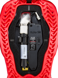 Alpinestars Tech-Air® 5 Plasma Airbag Replacement Canister, Airbag System Accessory, red and black, close-up internal view showing the white argon inflator canister with silver clamp, electronic control unit with ON/OFF switch, and wavy ribbed red outer shell