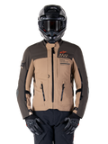 Alpinestars AMT-8 Stretch Drystar XF Jacket, Motorcycle Adventure Touring Jacket, Dark Khaki and Dark Brown, featuring orange Astars logo and black zippers, worn with black adventure helmet and gloves, full riding gear setup