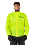 Alpinestars Hurricane Rain V2 Jacket, Motorcycle Rain Jacket, Yellow Fluo, worn by a model with black pants and gloves, high collar with reflective tabs, front storm flap with Alpinestars logo, high-visibility waterproof gear