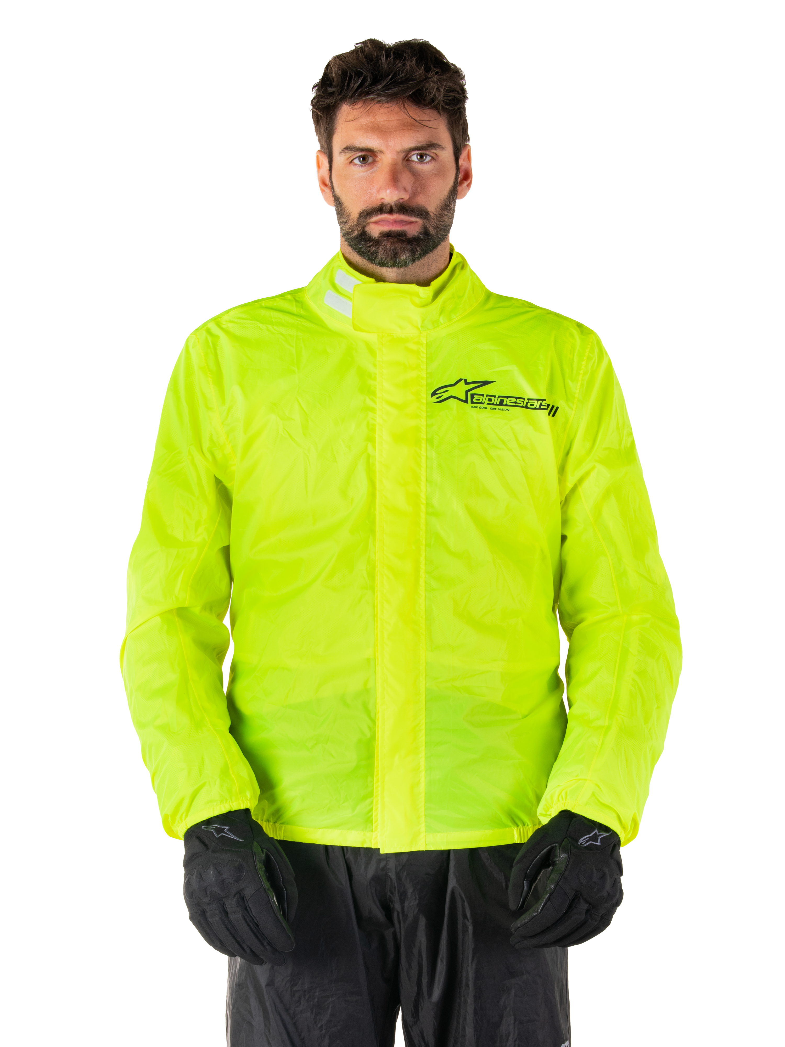 Alpinestars Hurricane Rain V2 Jacket, Motorcycle Rain Jacket, Yellow Fluo, worn by a model with black pants and gloves, high collar with reflective tabs, front storm flap with Alpinestars logo, high-visibility waterproof gear