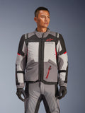 Alpinestars Andes V4 Drystar® Jacket, Motorcycle Adventure Touring Jacket, Dark Gray and Ice Gray with Black and Bright Red accents, worn with matching pants and gloves, waterproof and breathable design for all-weather adventure riding
