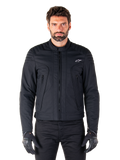Alpinestars Clayton WR Jacket, Black Motorcycle Jacket, worn by model, featuring quilted shoulder details and technical graphics, central Vislon zipper, vertical zippered pockets, small white logo on chest, urban riding gear for road use