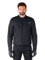 Alpinestars Clayton WR Jacket, Black Motorcycle Jacket, worn by model, featuring quilted shoulder details and technical graphics, central Vislon zipper, vertical zippered pockets, small white logo on chest, urban riding gear for road use