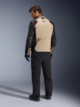 Alpinestars Andes Pro Drystar® XF Jacket, Motorcycle Jacket, Walnut and Black with red accents, back view on model, adventure touring design with large rear storage pocket, worn with black riding pants and gloves.