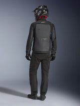 Alpinestars Cusco Drystar® Jacket, Black and Deep Gray, back view of rider wearing full adventure touring gear, large gray back panel with Alpinestars logo, blue sleeve accents, worn with matching black pants and helmet.