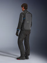 Alpinestars Cusco Drystar® Jacket, Black and Deep Gray, back three-quarter view showing large rear ventilation panel and blue accents on sleeves, worn with black motorcycle pants and boots for a complete touring outfit.