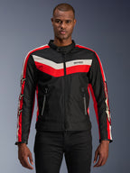 Alpinestars T-Dyno WR Jacket, Textile Motorcycle Jacket, Black with Bright Red and Ecru Chevron Stripes, vintage-inspired biker fit, high collar with button closure, zippered front pockets, star logos on sleeves, worn by model