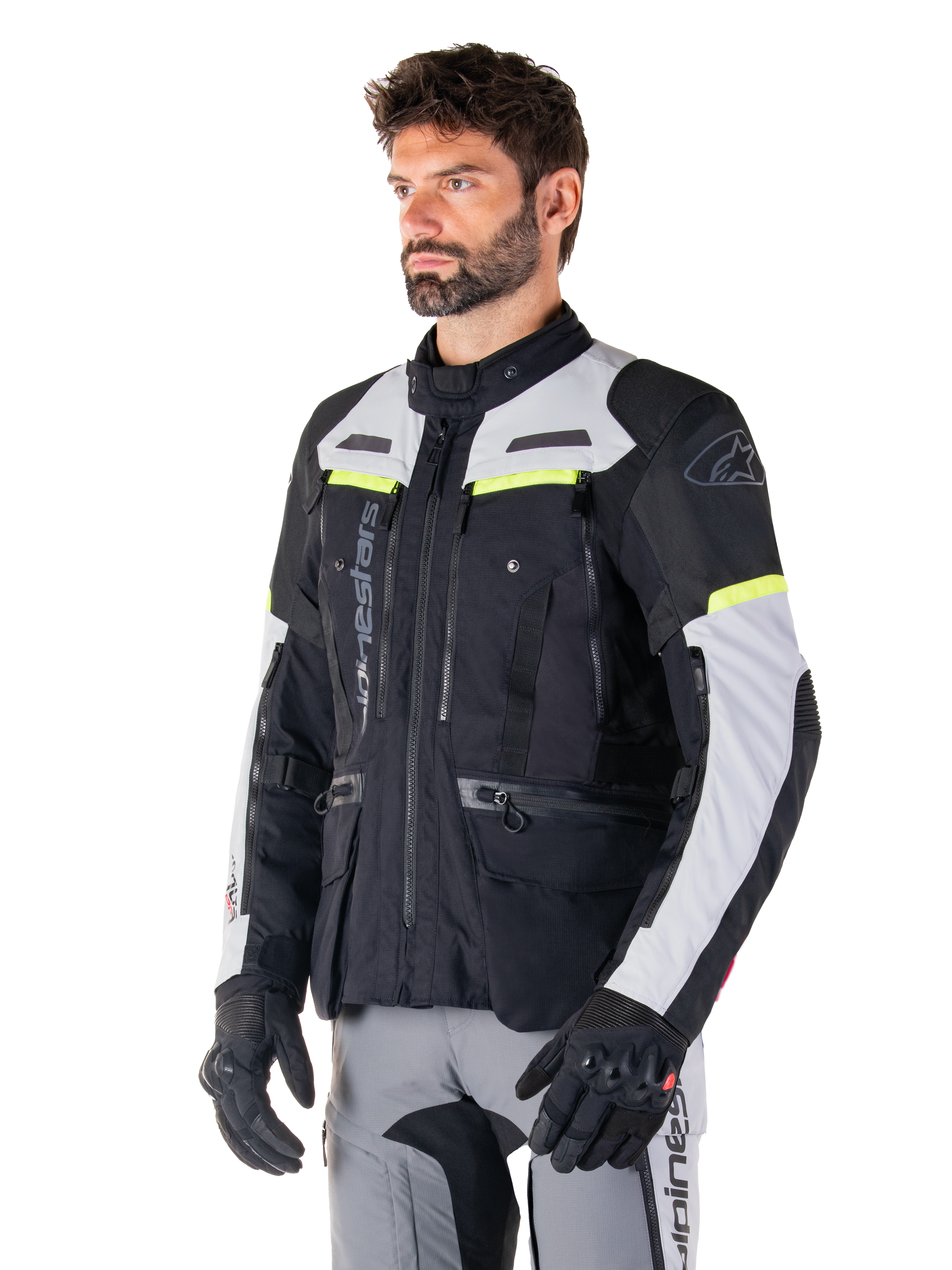 Alpinestars Bogotá Pro Drystar® Jacket, Black and Ice Gray adventure touring jacket with Yellow Fluo accents, worn by a man.