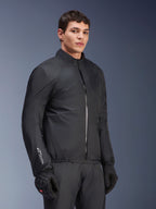 Alpinestars Andes Air Drystar® Jacket waterproof membrane, Black, worn by a male model with black gloves and pants, lightweight technical textile with 'Drystar' branding on the sleeve, studio shot