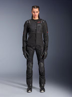 Alpinestars Stella Andes Air Drystar Pants, Women's Motorcycle Touring Pants, Black, featuring mesh ventilation panels and reinforced knee protection, worn with matching jacket and gloves, adventure touring apparel