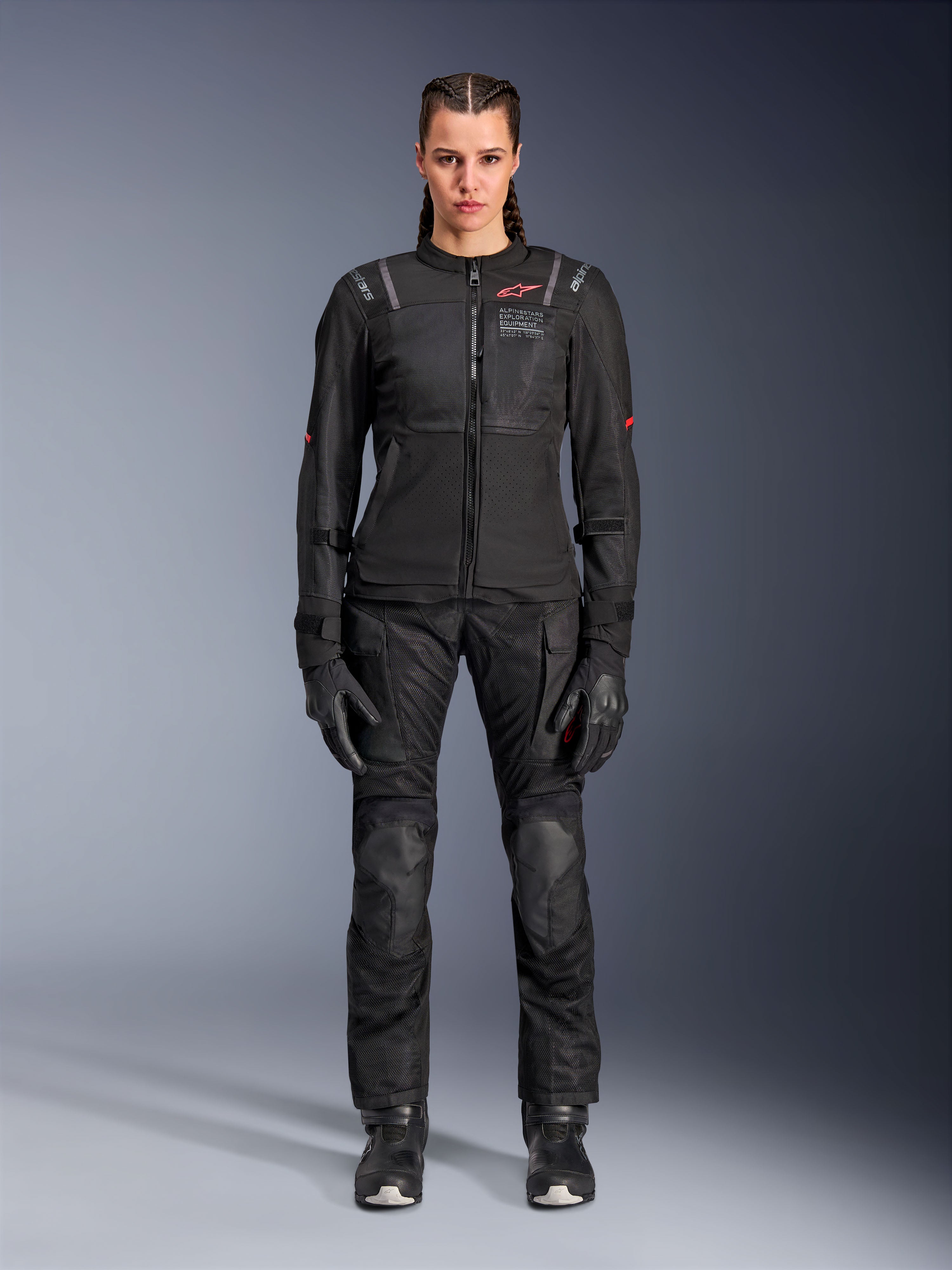 Alpinestars Stella Andes Air Drystar Pants, Women's Motorcycle Touring Pants, Black, featuring mesh ventilation panels and reinforced knee protection, worn with matching jacket and gloves, adventure touring apparel