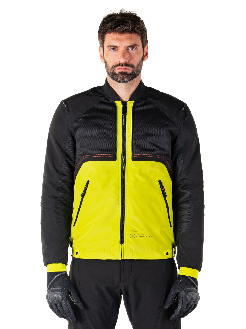 Mootant Waterproof Parka, modular motorcycle jacket, Lime Punch and Black, worn by a male model with black gloves and pants, featuring a vibrant yellow lower body and black upper torso and sleeves, utilitarian design for all-weather riding