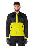 Mootant Waterproof Parka, modular motorcycle jacket, Lime Punch and Black, worn by a male model with black gloves and pants, featuring a vibrant yellow lower body and black upper torso and sleeves, utilitarian design for all-weather riding