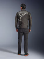 Alpinestars Axton Jacket, Motorcycle Jacket, Black Anthracite Red Tangerine, back view showing large grey Alpinestars logo and star graphic, accordion shoulder panels, worn with black pants and casual black shoes.