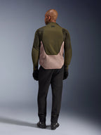 Alpinestars Aeroshell Airflow Jacket in Forest Sand, rear view on rider featuring breathable mesh and laser perforations.