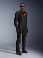 Model wearing Alpinestars Viper Air V4 Jacket in Black and Red Fluo, featuring mesh panels and red star logos on the chest and shoulder, paired with matching black motorcycle pants, gloves, and riding shoes, professional road riding gear ensemble