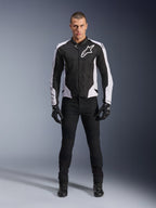 Alpinestars Viper Air V4 Jacket, Black and White motorcycle jacket with large white logo on chest, worn by a male model with black pants and gloves, featuring mesh panels for ventilation, sporty road riding apparel