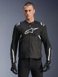 Alpinestars T-SPS Air V2 Jacket, Textile Motorcycle Jacket, Black with White Accents, large white chest logo, perforated mesh design for ventilation, worn with black pants and gloves