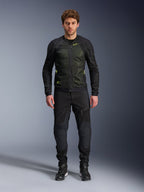 Male model wearing Alpinestars Troop-Air Jacket in Black Yellow Fluo, featuring technical mesh panels and bright yellow accents, paired with black riding pants and shoes, contemporary motorcycle apparel for warm weather