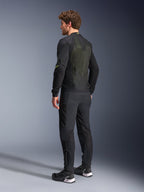 Alpinestars Troop-Air Jacket in Black and Yellow Fluo, rear view of a male model wearing the technical air jacket, featuring a large mesh back panel with yellow highlights and fluo yellow Alpinestars logos, paired with black motorcycle pants.