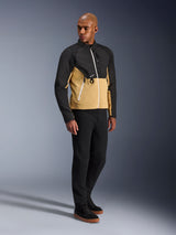 Alpinestars Provoke Jacket, urban motorcycle jacket, Black Camel, worn by a model with black pants and sneakers, two-tone textile design with black upper and camel lower torso, white zipper details, contemporary urban riding gear