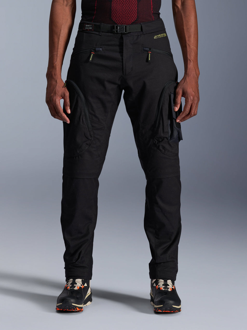 Alpinestars Acteon Pants, Black Urban Motorcycle Pants, tapered regular fit featuring side cargo pockets with reverse coil zippers, integrated waist belt and yellow branding, protective textile riding gear
