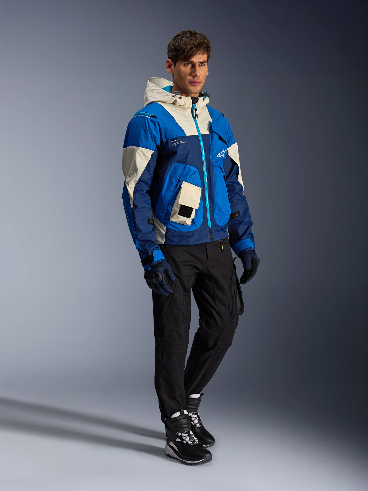 Alpinestars Mogress Air Jacket in Blue Almond, a men's textile urban motorcycle jacket with a hood and utility pockets.
