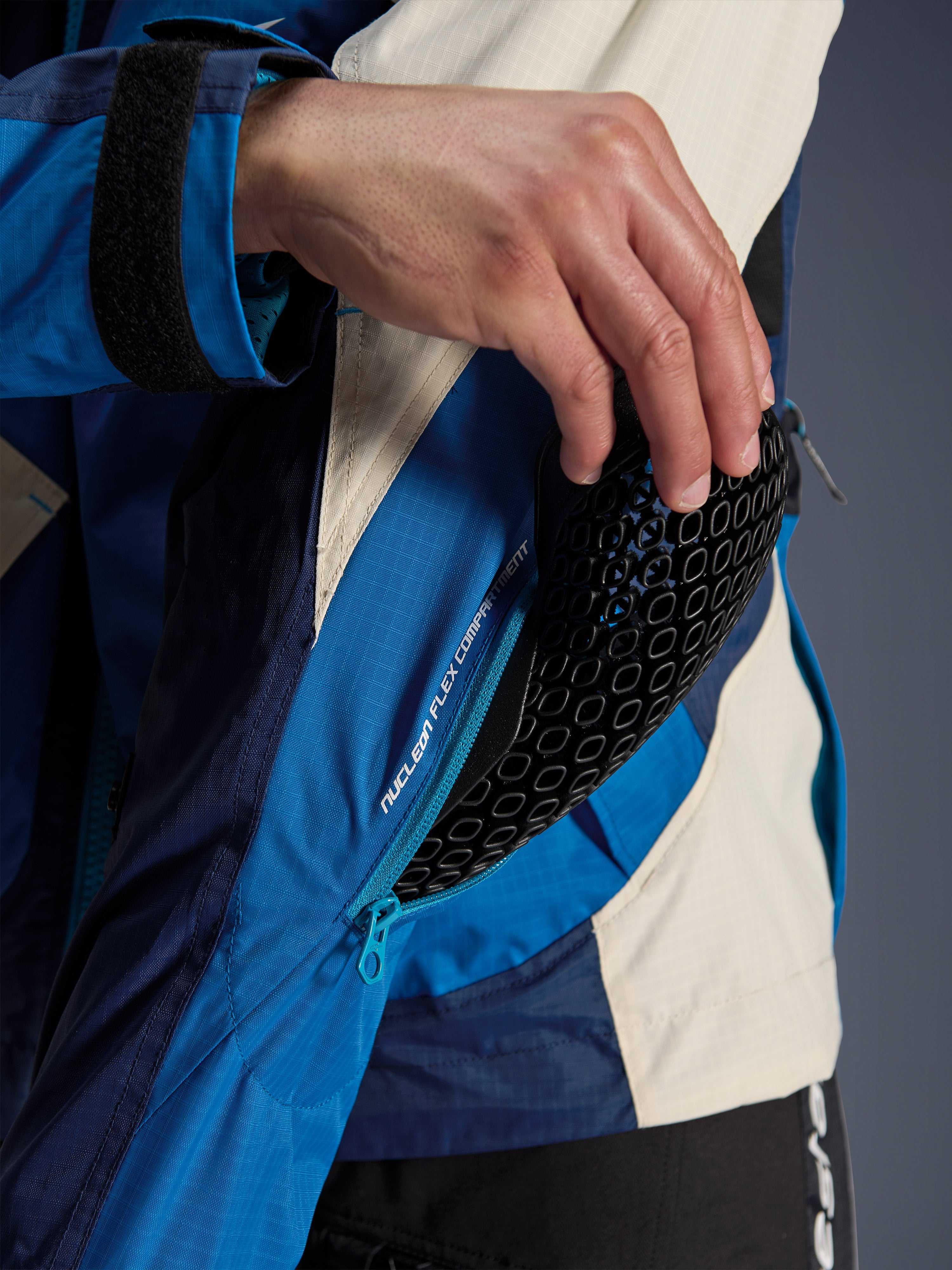 Alpinestars Mogress Air Jacket, Blue and Almond textile jacket featuring a Nucleon Flex Plus protector sleeve detail.
