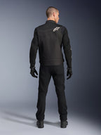Alpinestars T-Dyno Air Jacket, Black, Rear view on model, Textile motorcycle jacket featuring 3D mesh panels and a white star logo on the shoulder, worn with black pants and gloves, modern urban riding outfit