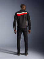 Alpinestars T-Dyno Air Jacket, Men's Textile Motorcycle Jacket, Rear view, Black with Bright Red and Ecru horizontal stripes across the back, Alpinestars logo on the yoke, worn with black pants and boots, breathable 3D mesh construction
