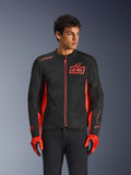 Alpinestars MM93 C-1 Air Jacket, urban motorcycle jacket, Red Fluo and Black, worn by a model with matching red gloves and black pants, featuring bold 93 Marc Marquez chest logo and mesh panels for airflow
