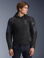 Alpinestars Zaca Air Venom WP Jacket, Black and Electric Blue, textile motorcycle jacket with a detachable hood and 3D mesh panels for ventilation, features DFS Lite shoulder sliders and ASTARS branding on the chest, worn by a male model, sport-inspired urban riding gear