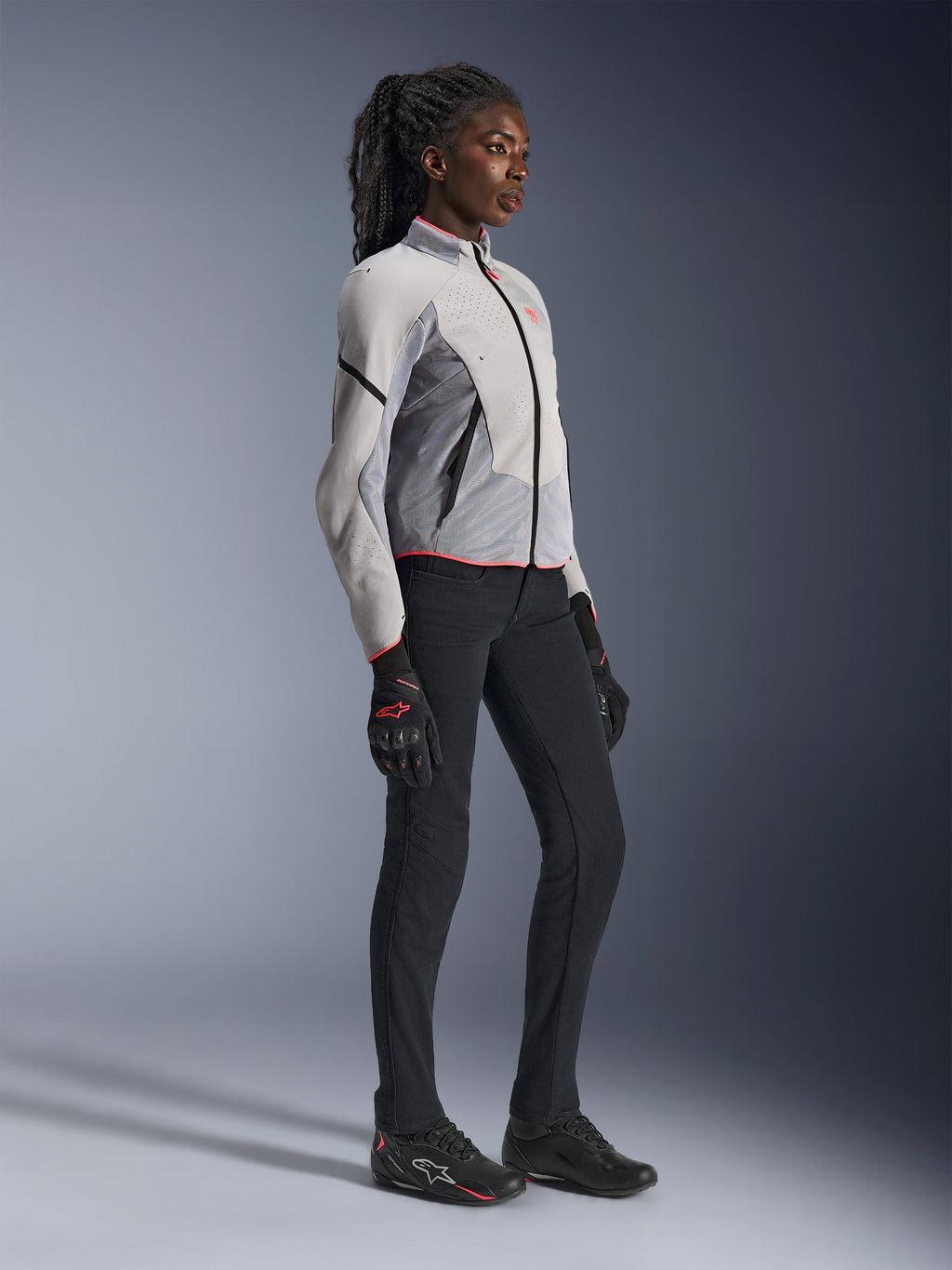 Alpinestars Women Stella Aeroshell Airflow Jacket for motorcycle racing, Mid Gray and Anthracite, featuring lightweight softshell construction and laser perforations, worn by a model.