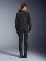 Alpinestars Stella Grace Jacket, Women's Urban Motorcycle Jacket, Black, back view showing workwear-inspired design, worn with black slim-fit pants and black boots, studio shot
