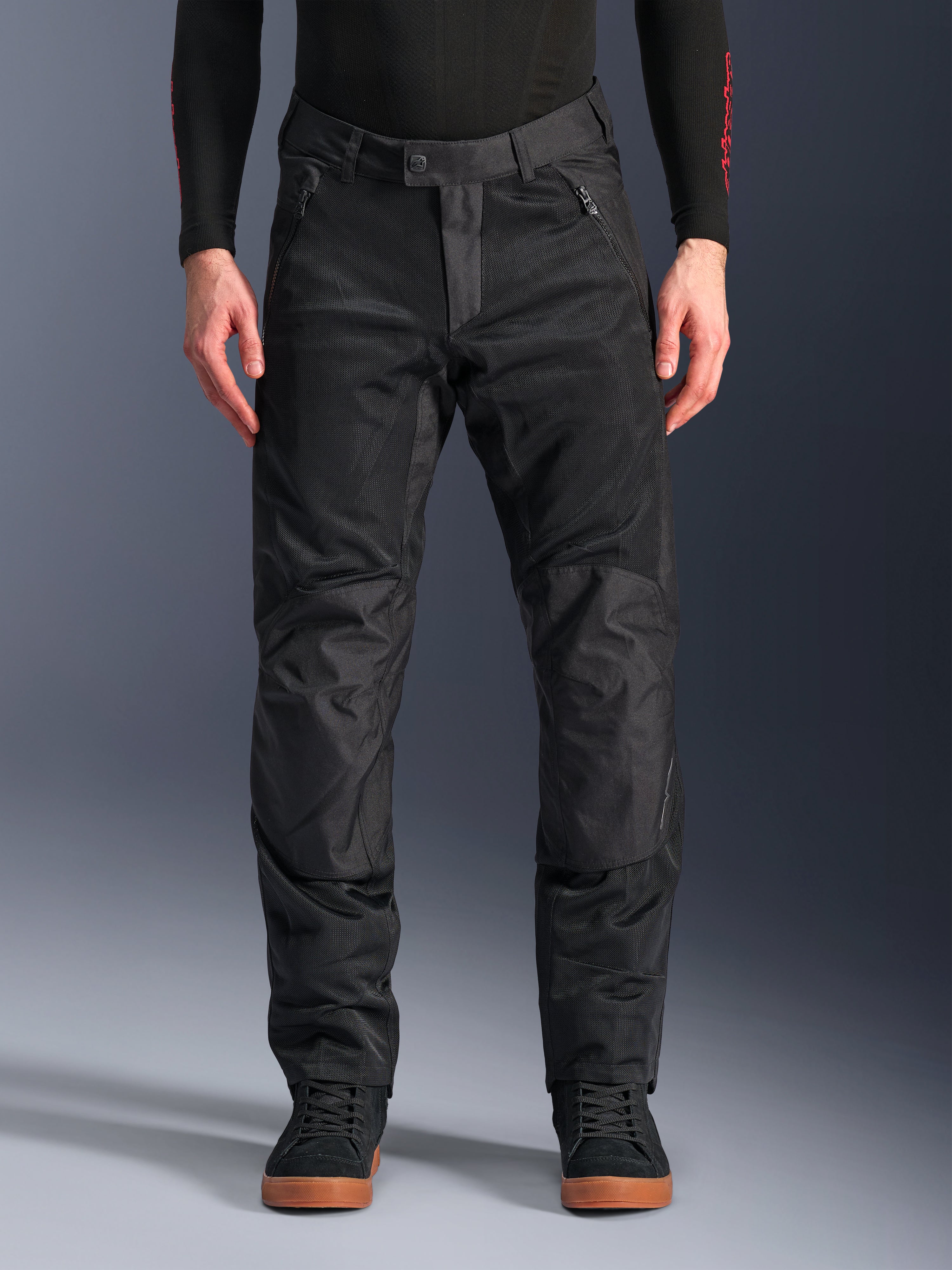 Alpinestars C-1 Air Pants, Black Textile Motorcycle Pants, urban riding gear featuring extensive mesh panels for airflow, reinforced knee sections, zippered front pockets, and a clean tailored fit.