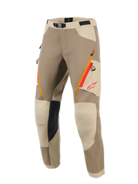 Alpinestars Maxdura Dual Pants, Adventure Motorcycle Pants, Walnut and Aluminum tan colorway, featuring orange and red zippered thigh pockets, light beige reinforced knee panels with black inner grip, and red Alpinestars logo, designed for dual-sport riding