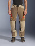 Alpinestars Maxdura Dual Pants, Walnut Aluminum, adventure motorcycle pants featuring red and orange zippered thigh vents, black leather inner knee panels, worn with a black base layer and rugged boots, durable multi-tonal design for dual-sport riding