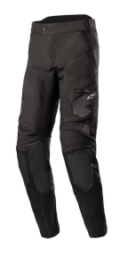 Alpinestars Venture XT Pants In Boot, Black Motorcycle Adventure Touring Pants, featuring reinforced knee panels and a zippered thigh pocket with a small white logo, water-resistant textile construction with ventilation ports, designed for dual-sport and off-road riding