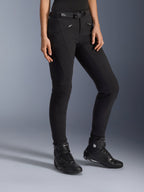 Alpinestars Alamosa Women Pants, Black Urban Motorcycle Pants, slim-fit design with zippered pockets and integrated waist belt, paired with black high-top riding shoes
