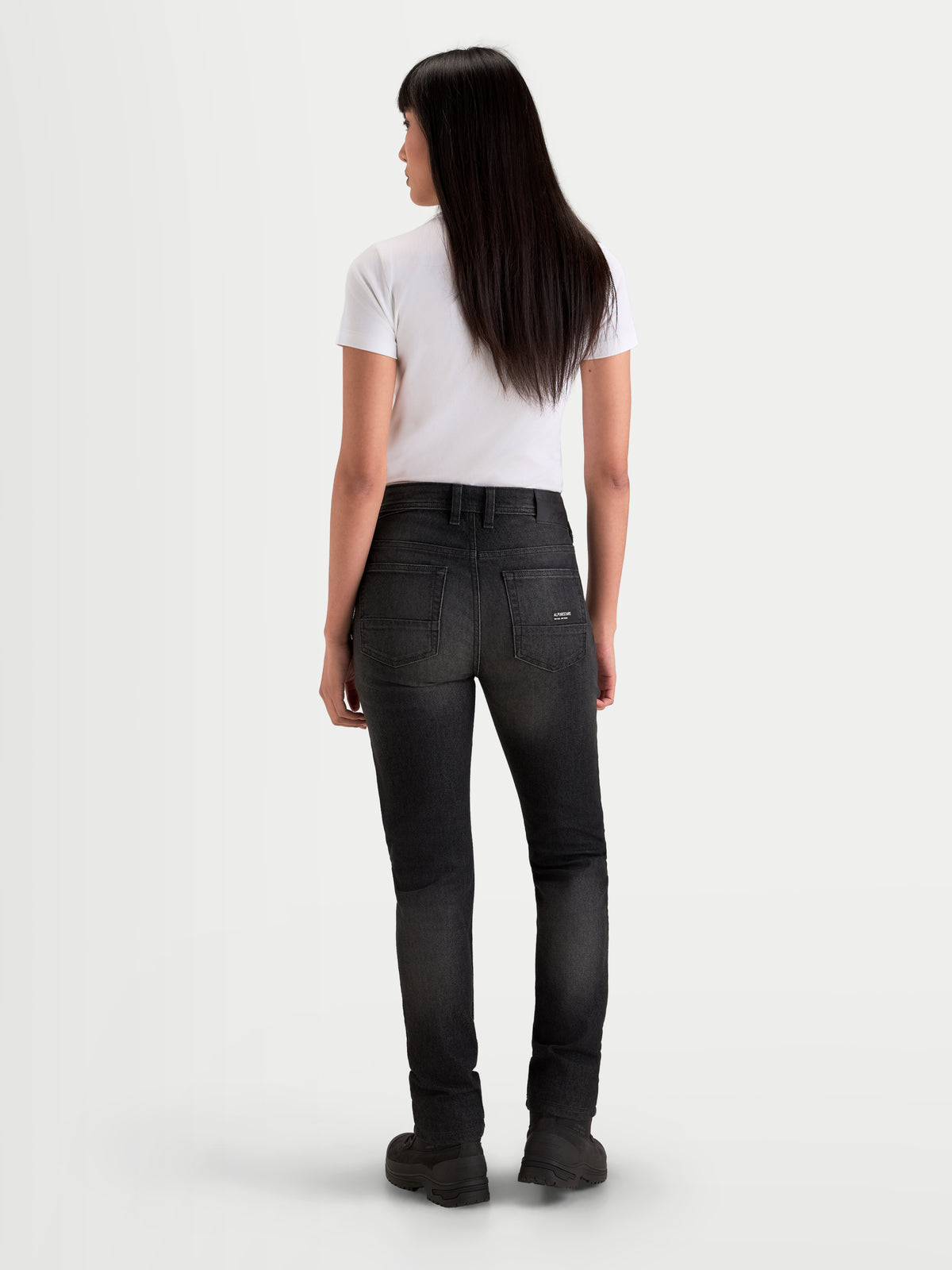 Alpinestars Stella Flex-AST 7 Denim Pants Short, women's urban motorcycle riding jeans, faded black, rear view showing single-layer technical denim construction and five-pocket detail worn by a model