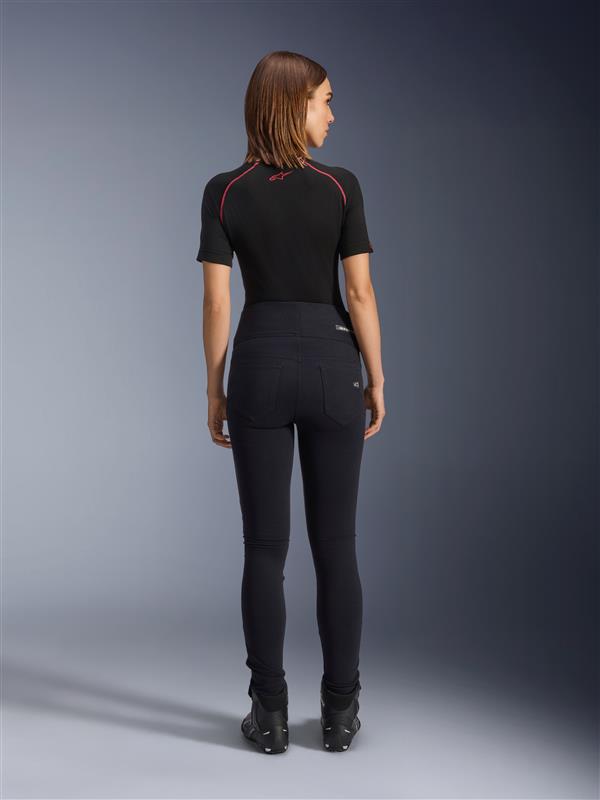 Alpinestars Stella Flex-Ast Leggings, Women's Motorcycle Leggings, Black, rear view showing high-waisted slim fit, worn with black short-sleeve top and black riding boots, urban riding gear