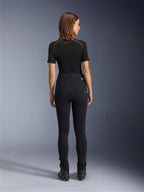 Alpinestars Stella Flex-Ast Leggings, Women's Motorcycle Leggings, Black, rear view showing high-waisted slim fit, worn with black short-sleeve top and black riding boots, urban riding gear