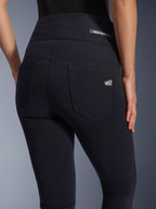 Alpinestars Stella Flex-Ast Leggings, Women's motorcycle leggings, Black, back view featuring high-waisted design, two rear pockets, Alpinestars logo on waistband and right pocket, form-fitting textile for urban riding